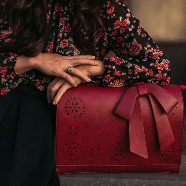 Claire’s Elegant Bow-Tie Satchel