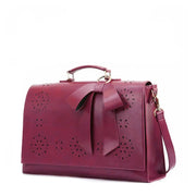 Claire’s Elegant Bow-Tie Satchel